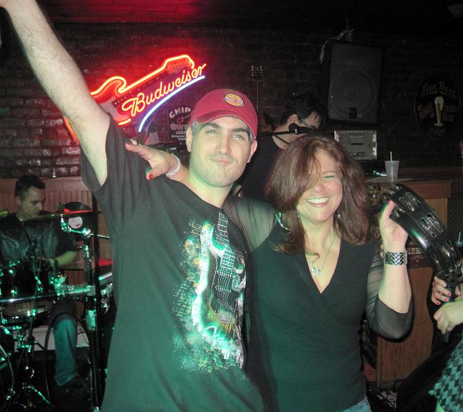 20march1025.jpg - Eugene and Jen rock out to a little Skynyrd